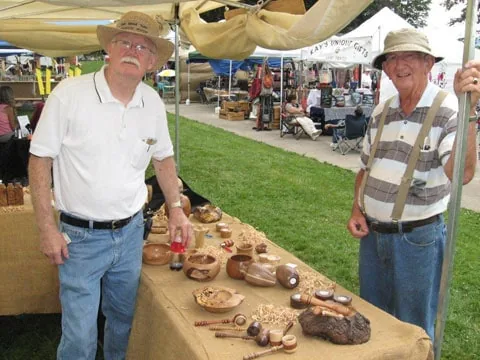 Handmade wooden bowls at an outdoor park festival
