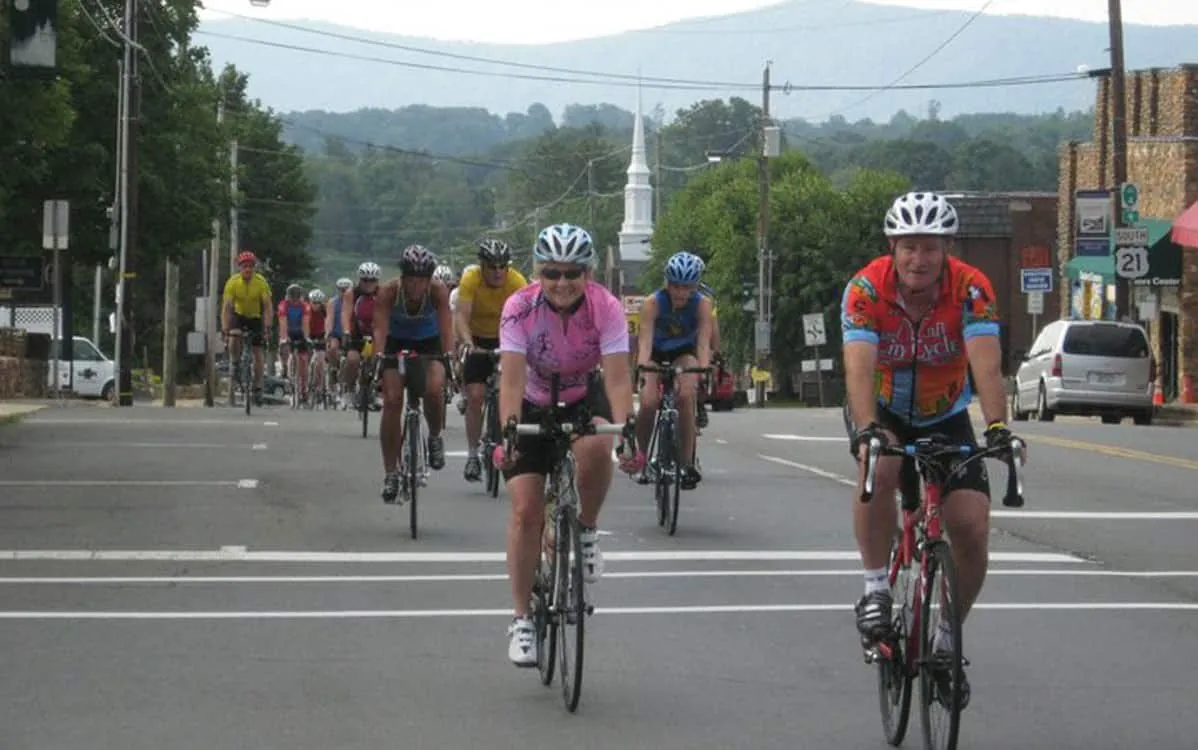 Cyclists in the Tour de Mountains riding down Main Street in Sparta